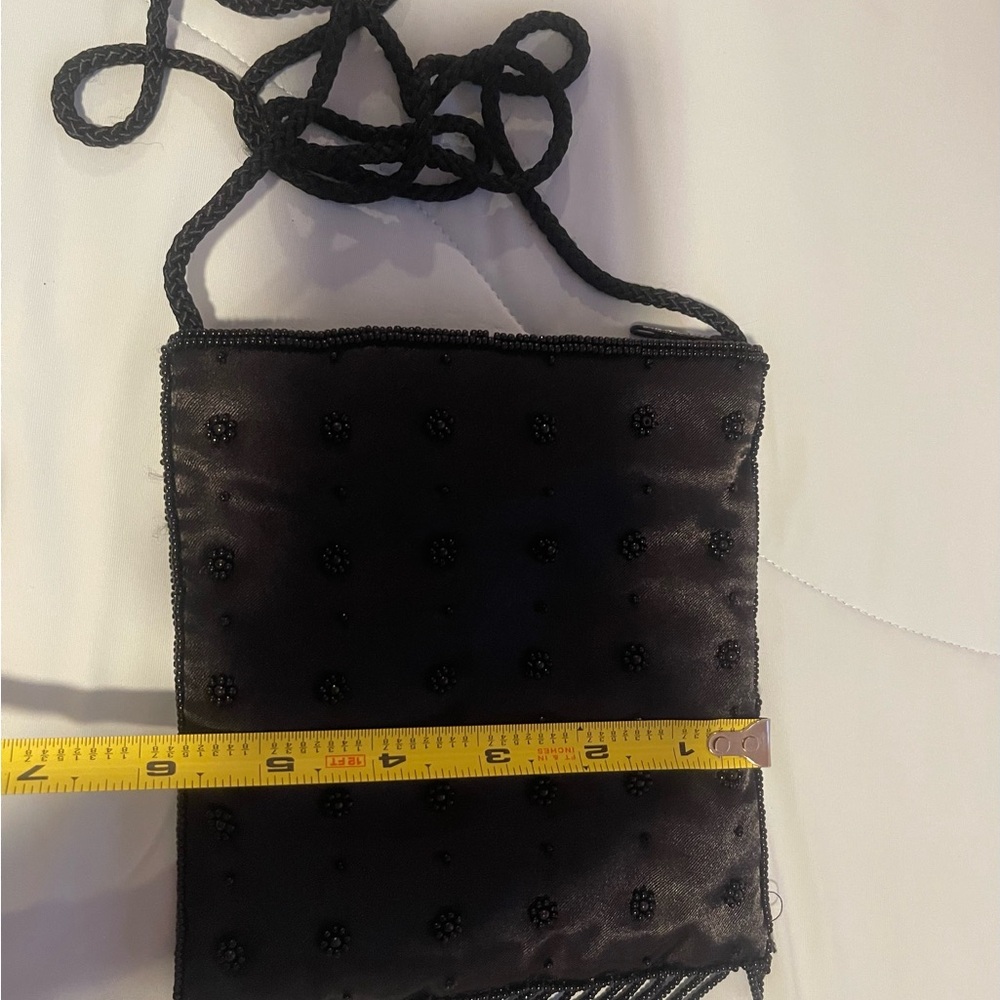 Satin beaded crossbody black purse.Zip closure. 6”x6”x1”  and 21” Handle - Picture 7 of 9